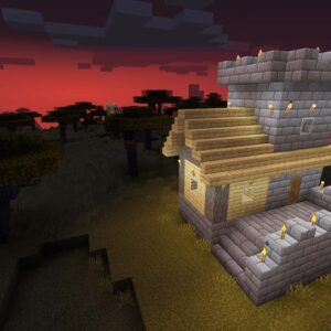 Spelet Minecraft visar en borg mot mörkröd himmel.